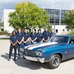 Automotive restoration technology students with the Chevelle outside Madigan Library