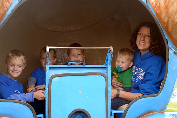 Kimberly R. Cassel, director of student activities, bravely joins a boys' day out.
