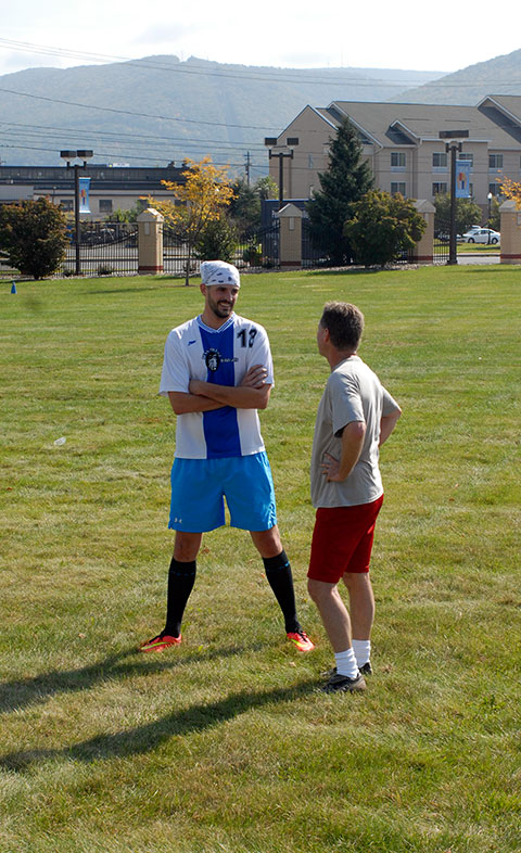 Ryan J. Steer (left), who graduated in 2013 with a bachelor's degree in plastics and polymer engineering technology, reunites with plastics professor and Penn College Ultimate Frisbee Team coach Kirk M. Cantor.