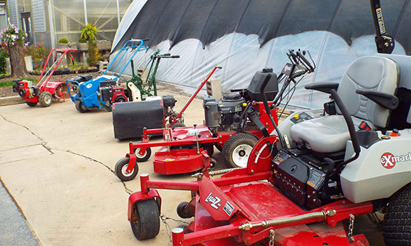 A display of landscaping equipment through the years