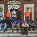Members of the Sustainable Landscape Procedures and Practices class, who finished the job of trimming and mulching at the YMCA, gather on the facility's front steps.