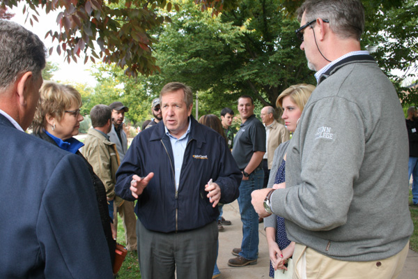 Carl Peters (center) director of training for Lincoln Electric, a Cleveland-based company with a long-playing record of supporting Penn College, converses with administrators and students following the “Student Bodies” dedication. 