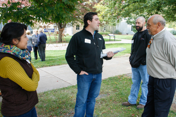 Andrew S. Wisner (center), a 2008 welding and fabrication engineering technology alumnus – and a former Student Government Association president, reminisces with retired dean and faculty member Donald O. Praster (right).