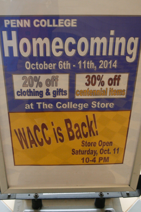 A Bush Campus Center sign touts discounted merchandise at The College Store, as well as a shout-out to returning WACC alums.