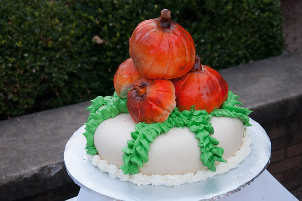 Fondant pumpkins top an Oktoberfest cake.