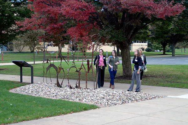 Valerie L. Fessler (second from left), annual giving specialist, leads a group past 