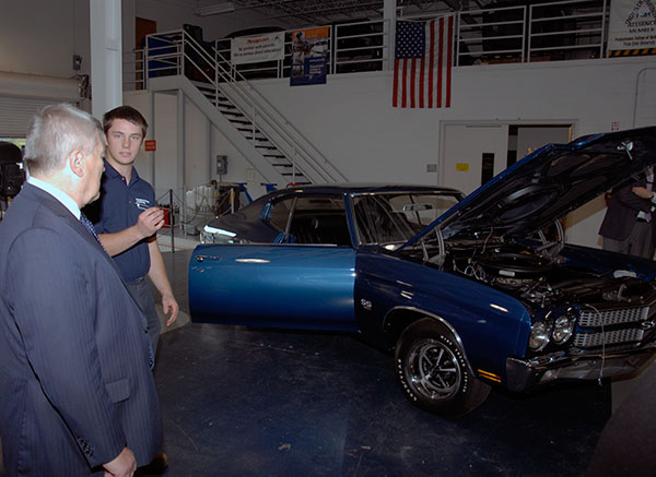 Sean M. Hunter, an automotive restoration technology major from Livingston, New Jersey, proudly displays students' work on a 1970 Chevelle Super Sport. The latest restoration project in conjunction with the Antique Automobile Club of America Museum, the car will be entered in competition at Hershey this week.