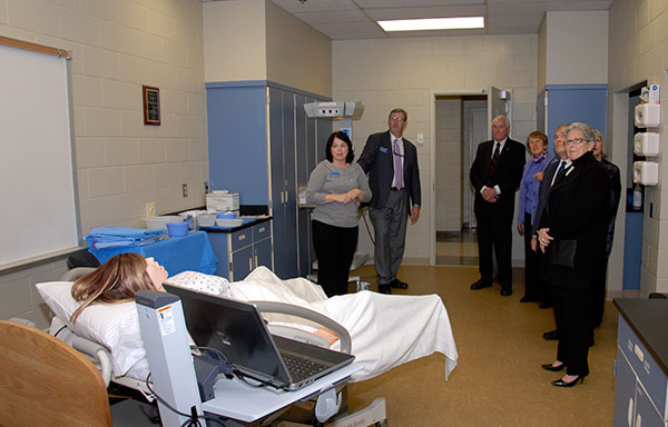 The group tours the School of Health Sciences, assessing the 