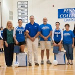 Kaitlyn A. Klein (15) and Courtney L. Gernert (2) join their families and coaches for a Senior Night tribute during Thursday's match against the University of Valley Forge.