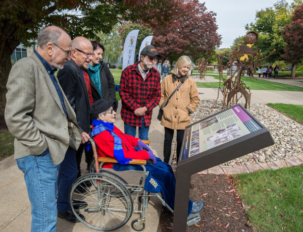 Michael K. Patterson is joined by family and friends at one of the History Trail markers for 