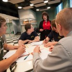 Carolyn Shirk, of EconomicsPennsylvania, talks with a group from SUN Tech. 