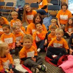 Sporting colorful Children's Learning Center shirts, the Penn College entourage fills the floor ...