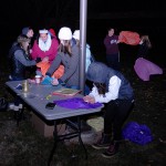 Members of Penn College Benefiting THON help assemble the fragile paper lanterns.