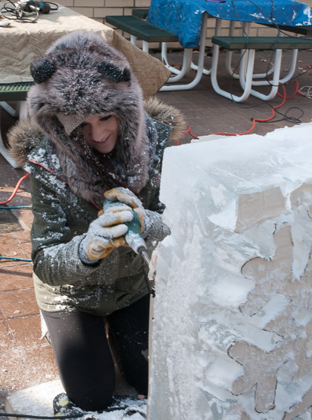 Shelby K. Roche defines the shape of a snowflake “relief” ice sculpture.