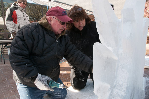 Monica Lo Furno, also an ice carver, offers instruction to student Tracy A. DeCoursey.