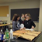 Students help themselves to pizza and soda in honor of their first-year success.