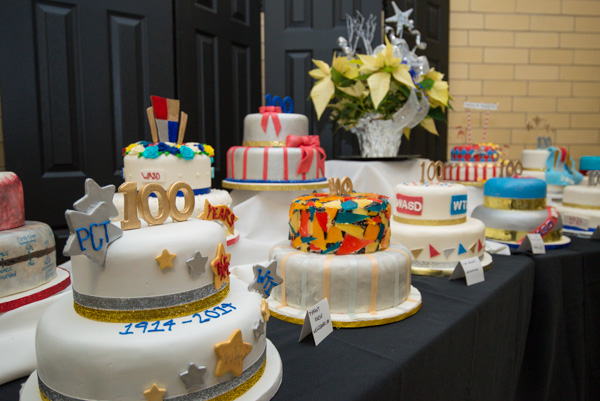 Ravishing renditions of Centennial celebration fill the cake table.