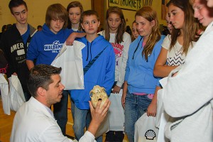 Justin M. Ingram (center), assistant professor of biology at Penn College, shares scientific insights with Tioga County eighth-graders at the STEM Awareness Career Day. (Photo provided)