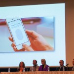 A biometric image on a smartphone – technology only recently embraced by Bock (third from left) – recalls her September lecture on identity protection.
