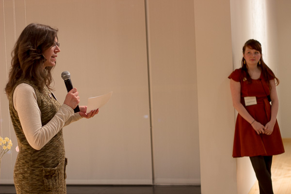 Gallery manager Penny G. Lutz introduces the artist's talk ...