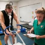 Cyclist Dick Kaiser dons a breathing mask as the CardioCoach VO2 max calculator measures his carbon-dioxide vs. oxygen output. 