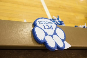 A foam Wildcat paw, a giveaway at a recent hoops doubleheader, lends silent support to the home team. (Photo by Dalaney T. Vartenisian, student photographer)