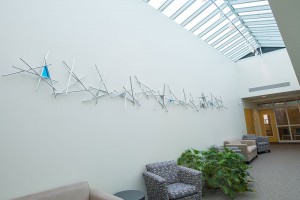 "Collaboration," a 23-foot metal sculpture honoring the service of Penn College President Davie Jane Gilmour, graces a wall in the Student & Administrative Services Center on the college campus.