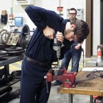 Heavy construction equipment technology: technician emphasis student Steven M. Rush (background), of Rimersburg, assesses the aptitude of SUN Area Technical Institute's Garritt Aucker.