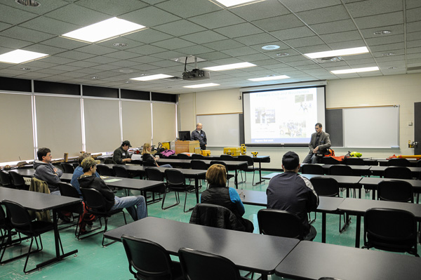 Andrew Bartholomay (left), assistant professor, and instructor Eric C. Easton talk with forest technology prospects.