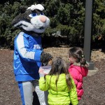Donning rabbit ears and carrying a basket of treats, the Wildcat easily attracts some young friends.