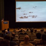 Footage of WWII endeavors enhances the presentation. 