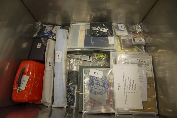 A glimpse inside at the items being layered into the time capsule 