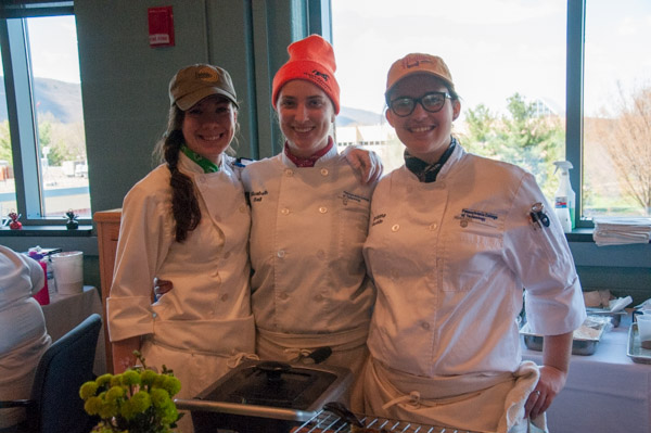 Outdoor lovers all: event partners Victoria L. Zablocky, of Jersey Shore; Elizabeth M. Ball, of Phoenixville; and Brianna E. Bucklin, of Whitehall; serve up a fishing-and-camping themed menu.