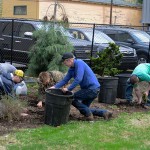 Students clean up the century-old garden spot after a seemingly interminable winter.