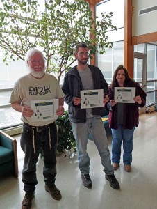 From left, Penn College forest technology students Mark J. Weist, of Montgomery; Derek S. Labs, of Jersey Shore; and Sharon L. Morris, of Liberty, hold their honor certificates in the Schneebeli Earth Center. (Photo by Pamela A. Mix,  secretary to the ESC executive director and assistant dean of transportation and natural resources technologies)