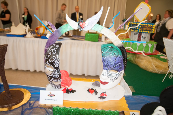 Feathers and masks adorn an intricate sugar centerpiece by Rachel C. Cooper, of Bangor.