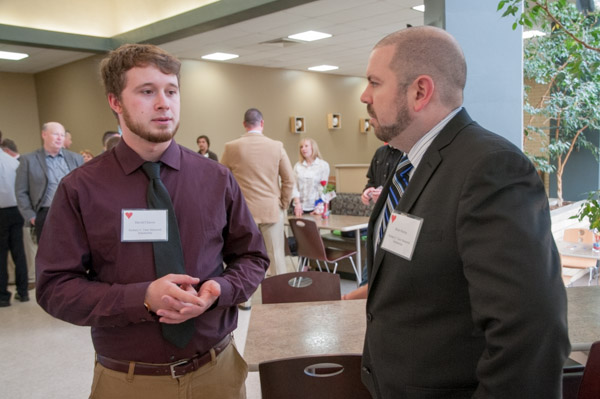 David T. Chavey, an automotive technology student from Hershey and the recipient of the Zachary C. Teter Memorial Automotive Scholarship, speaks with donor Brian Murray.