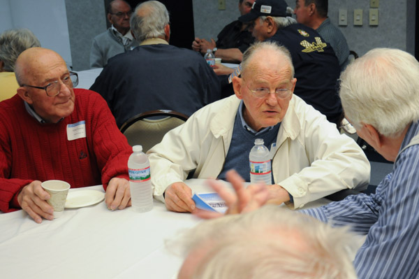 Alumni Allen Yearick, ’46; Fred Kramer, ’45; and D. Frederick Wascher, ’56, chat after check-in.