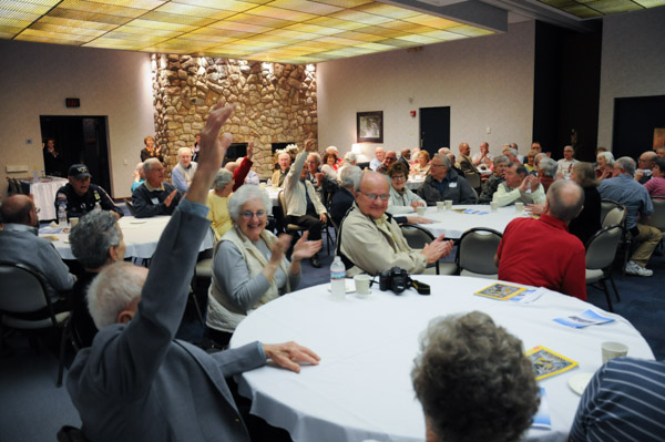 A strong showing of grads from the 1940s raise their hands.