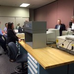 Timothy E. Weston, associate professor of plastics and polymer technology and department head, tells visitors that all 12 pending plastics graduates have secured jobs. 