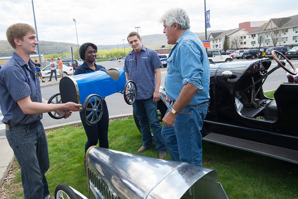 The students present Leno with a custom-made Bugatti mailbox in Wildcat blue. From left are Patrick O. Stephens, of White Mills; Mathurin; and Jonathan M. Eldred, of Greenwich, N.Y.