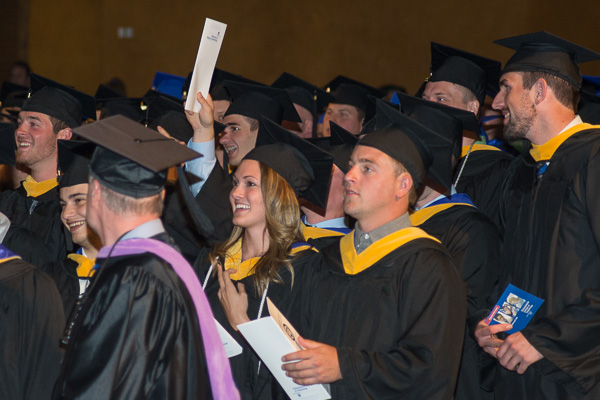 Soon-to-be-graduates share laughs with their faculty mentors as participants take their places.