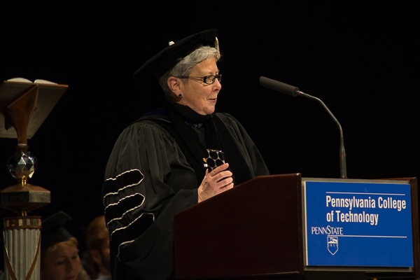 President Davie Jane Gilmour with her cell phone, inviting others to snap away and use #pctgrad when posting to social media. 