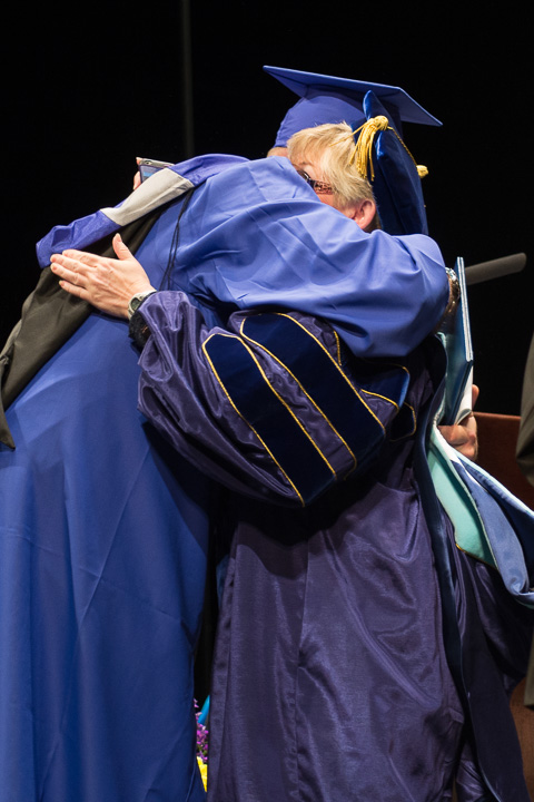 A heartfelt moment with Sandra L. Karnes, speech communications-composition faculty, and her son, Christopher J. Kent, of Bloomsburg, who graduated in renewable energy technologies.