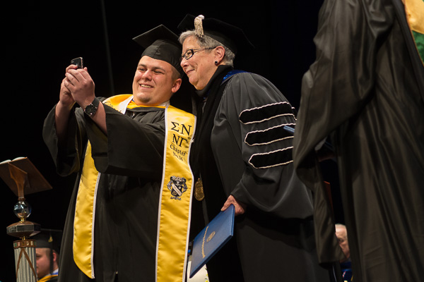 Proudly sporting the colors of his beloved Sigma Nu fraternity, Christopher M. Scheller freezes time with the president. The Sykesville, Maryland, resident graduated in building science and sustainable design: architectural technology concentration.