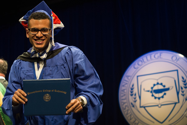 Fluid moves and a carefree spirit carry Wilmer I. Clase, of Lancaster, across the stage. After receiving his architectural technology degree Friday, he will return in the fall to work toward a bachelor's in building science and sustainable design: architectural technology concentration.