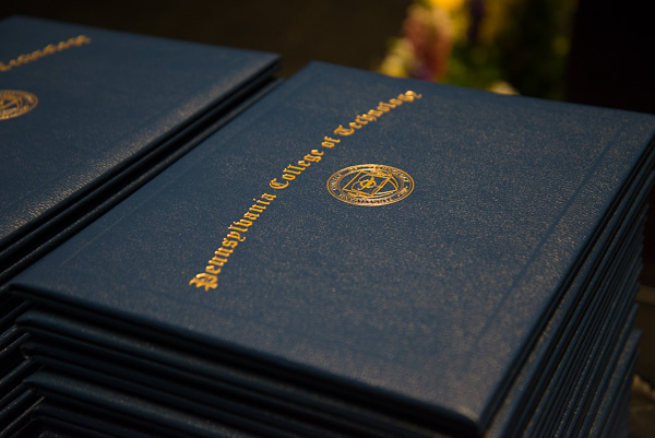 The day's most coveted object: a college degree, held by fewer than 7 percent of the world's population. 