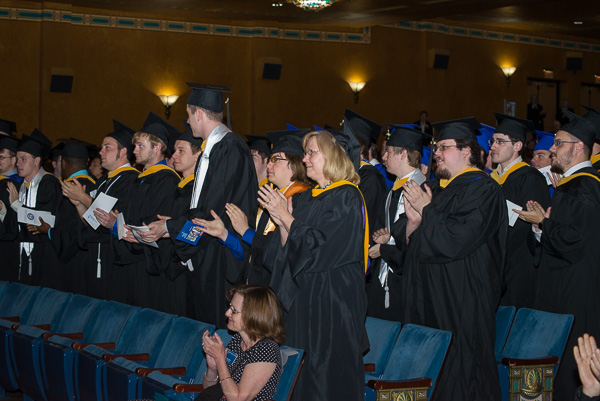 ... prompting a standing ovation from classmates that flowed throughout the venue.