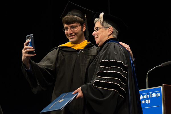 There's always time for another student photo, this time with Matthew A. Bamonte, of Milton, an inaugural graduate in information technology sciences-gaming and simulation.