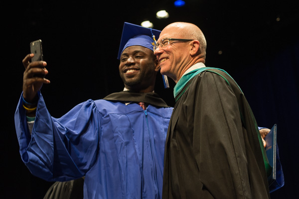 A student includes Steven P. Johnson, a member of the college's board of directors, in the selfie stream.